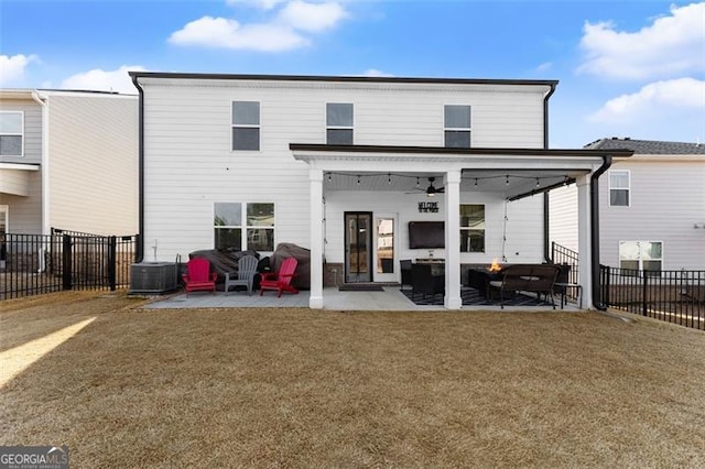 rear view of house with a fenced backyard, a patio, central AC, and a lawn