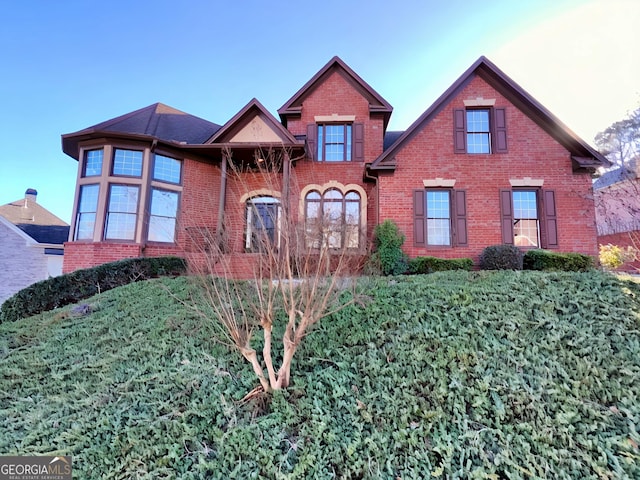 view of front of house featuring brick siding