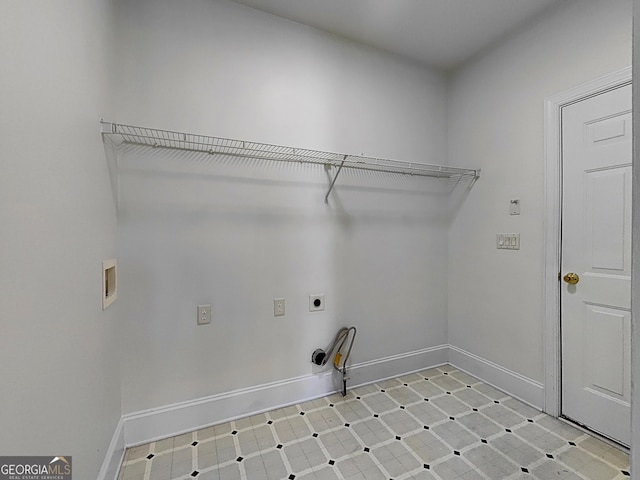 clothes washing area with laundry area, hookup for a washing machine, baseboards, and electric dryer hookup