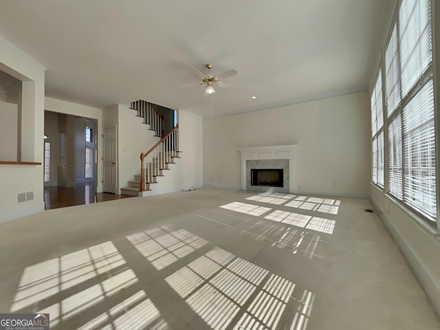 unfurnished living room with recessed lighting, a fireplace, visible vents, baseboards, and stairway