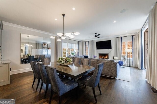 living room with a lit fireplace, a wealth of natural light, and recessed lighting