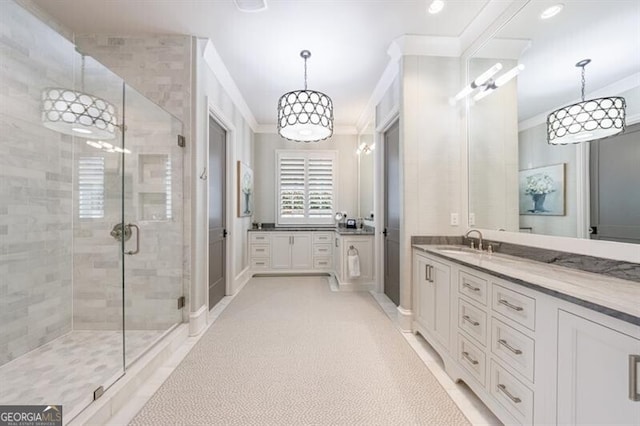 full bathroom featuring crown molding, recessed lighting, a stall shower, vanity, and tile patterned flooring