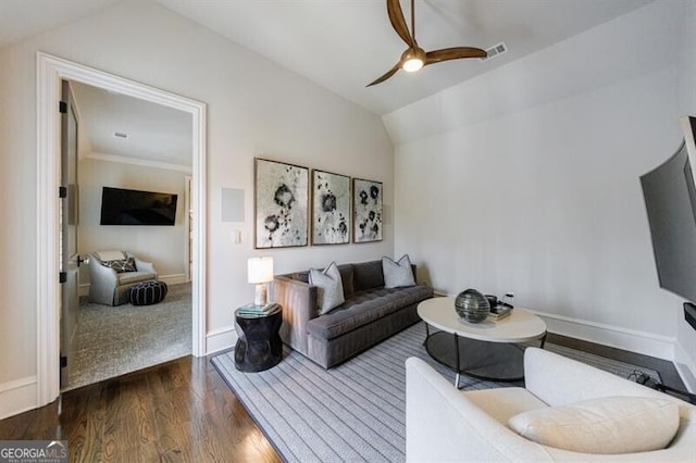 living room with vaulted ceiling, ceiling fan, wood finished floors, and baseboards