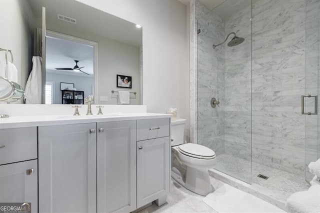 full bath featuring toilet, vanity, a shower stall, and visible vents