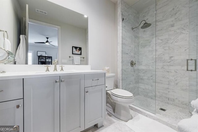 mudroom with dark wood-type flooring, track lighting, and baseboards