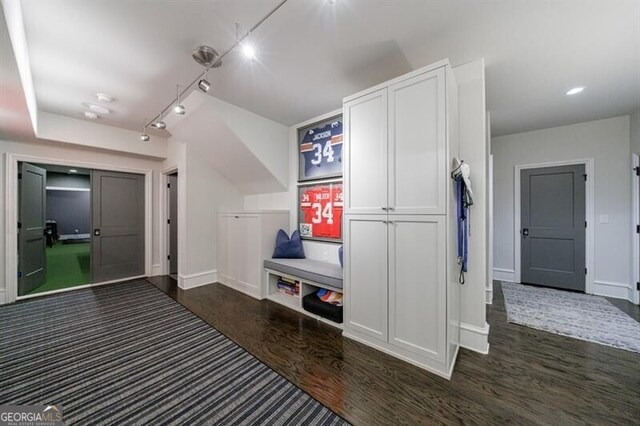 home theater room featuring golf simulator, carpet, and baseboards