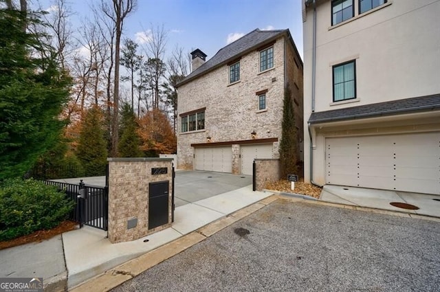 view of home's exterior featuring driveway, an attached garage, and stucco siding