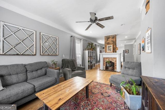 1015 Michigan Ave NW, Atlanta, GA 30314 - living area featuring light wood-style floors, ceiling fan, a brick fireplace, and recessed lighting