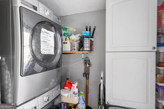1015 Michigan Ave NW, Atlanta, GA 30314 - laundry area featuring stacked washer and clothes dryer and a textured ceiling