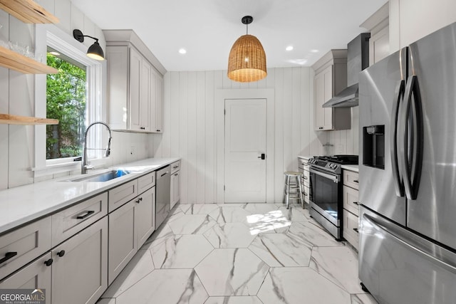 1015 Michigan Ave NW, Atlanta, GA 30314 - kitchen featuring stainless steel appliances, wall chimney exhaust hood, a sink, open shelves, and light countertops