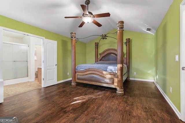 bedroom with lofted ceiling, wood finished floors, visible vents, and baseboards