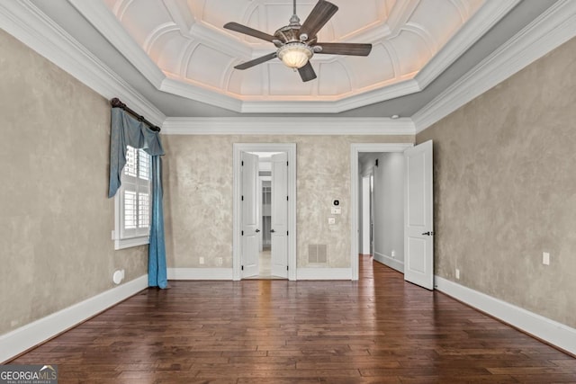 unfurnished bedroom with hardwood / wood-style flooring, baseboards, and crown molding