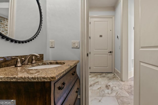 bathroom featuring ornamental molding and vanity