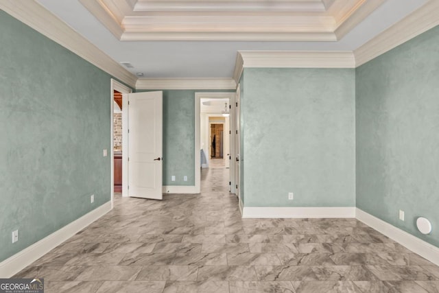 unfurnished bedroom featuring a tray ceiling and crown molding