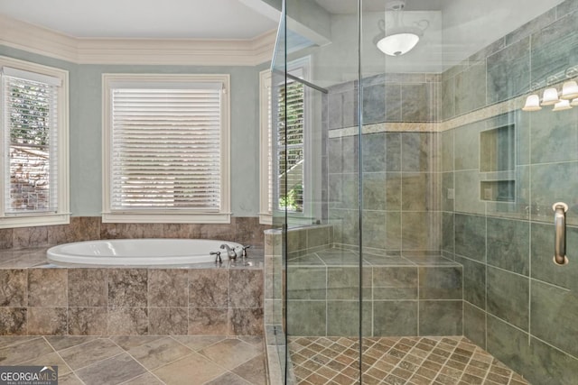 full bathroom featuring a stall shower, a healthy amount of sunlight, and a bath