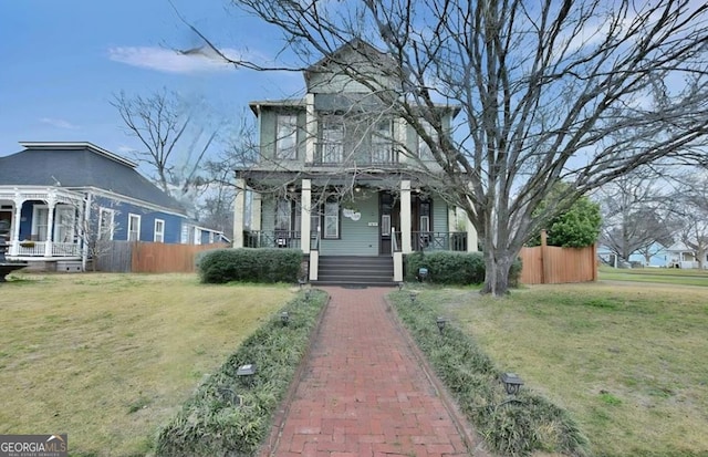 view of front of house featuring a porch, a front yard, fence, and a pergola