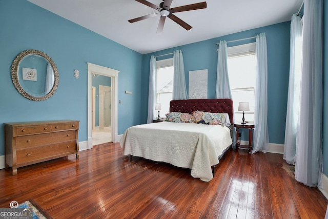 bedroom with ceiling fan, hardwood / wood-style floors, and baseboards