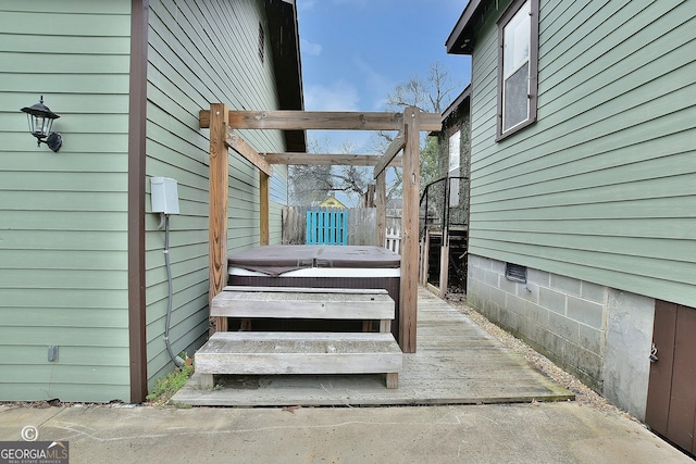 deck with a hot tub