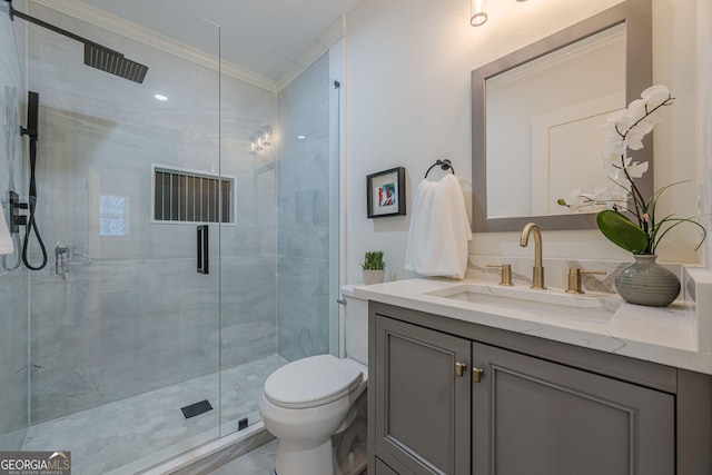 bathroom featuring vanity, toilet, a shower stall, and crown molding