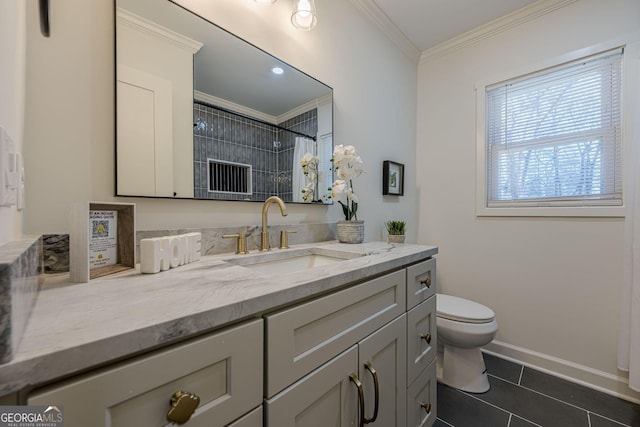 bathroom with crown molding, baseboards, toilet, tile patterned floors, and vanity