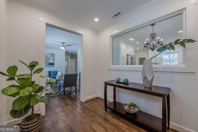 hall featuring visible vents, dark wood-type flooring, baseboards, ornamental molding, and recessed lighting