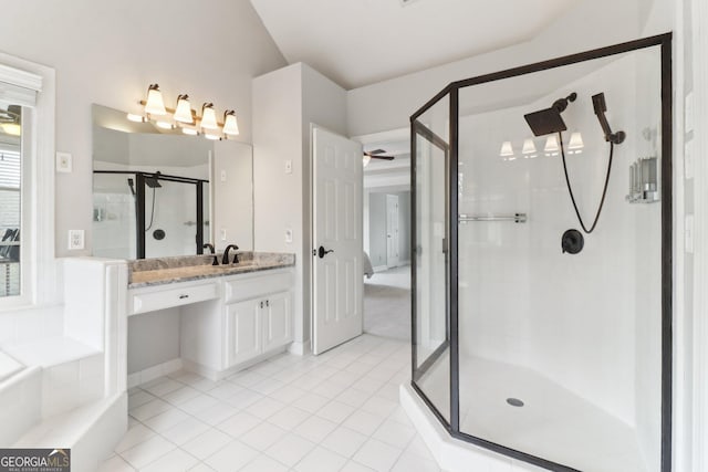 full bath featuring a tub, a stall shower, vanity, and tile patterned floors