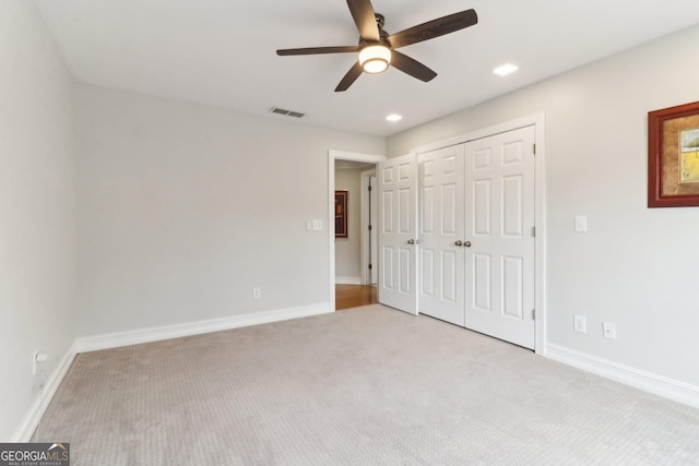 unfurnished bedroom with recessed lighting, visible vents, light carpet, and baseboards