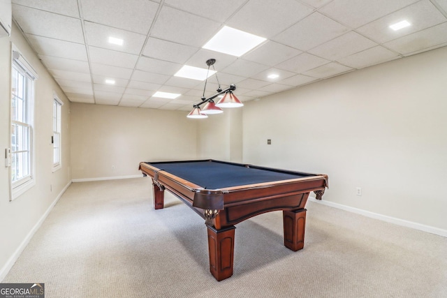 playroom featuring light carpet, baseboards, and a paneled ceiling