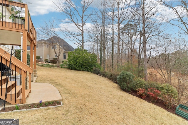 view of yard featuring stairway