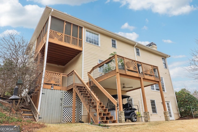 rear view of house with ceiling fan, stairs, and a wooden deck