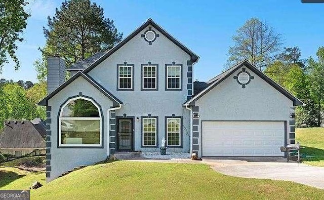 view of front of house with concrete driveway, stucco siding, a chimney, an attached garage, and a front yard