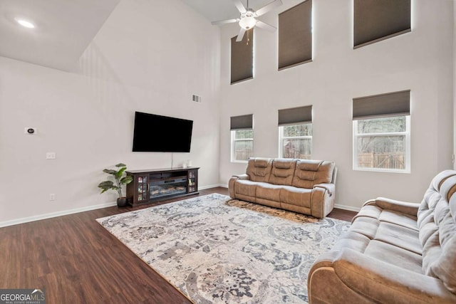 living area with dark wood finished floors and baseboards