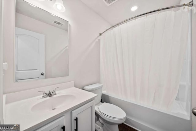 bathroom with shower / bath combination with curtain, visible vents, vanity, and toilet