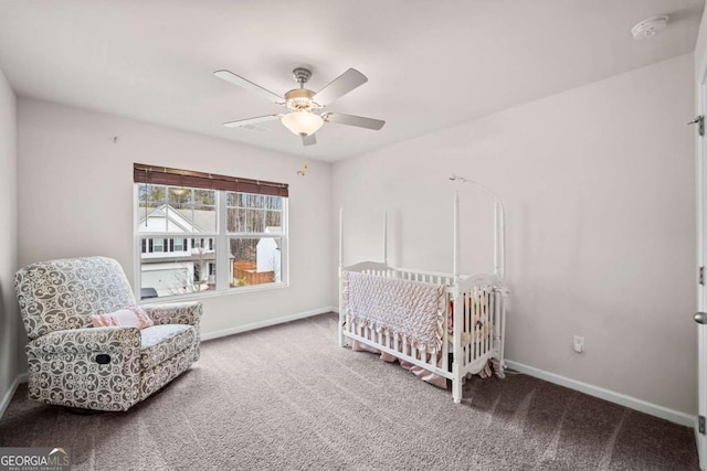 carpeted bedroom with baseboards and a ceiling fan