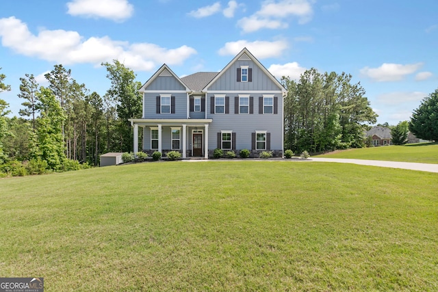 view of front of home featuring a front lawn and board and batten siding