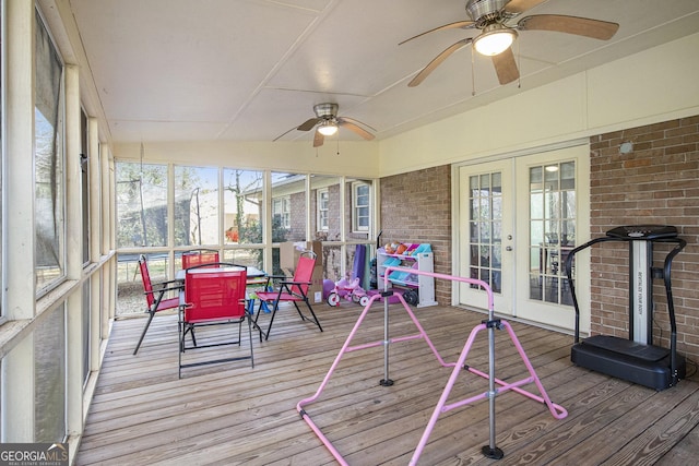 sunroom featuring french doors, ceiling fan, and vaulted ceiling