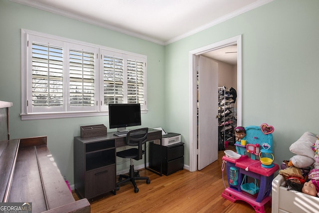 office featuring baseboards, wood finished floors, and ornamental molding