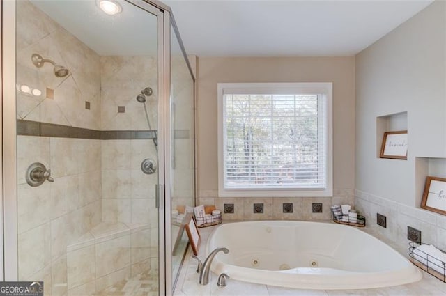 full bathroom featuring a jetted tub and a stall shower