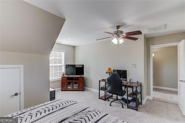 office area with visible vents, baseboards, ceiling fan, and carpet flooring