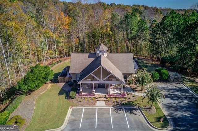 drone / aerial view with a view of trees