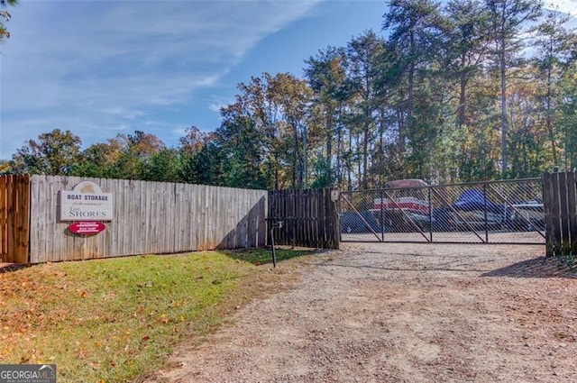 view of gate featuring fence