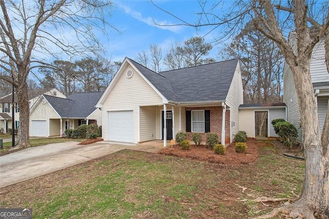 view of front of home with driveway, brick siding, and an attached garage