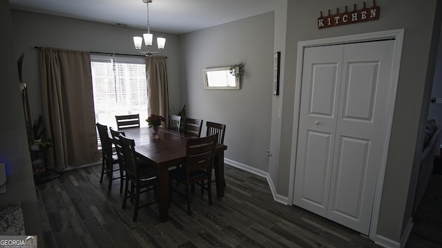 dining area featuring dark wood-style floors, visible vents, and baseboards