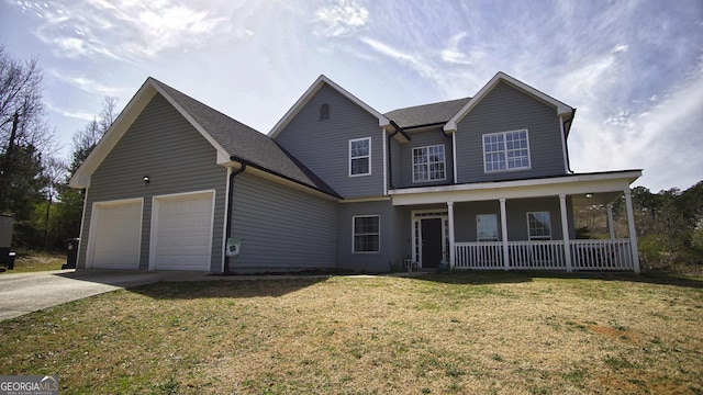 traditional home featuring a shingled roof, covered porch, an attached garage, driveway, and a front lawn