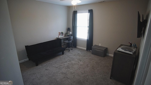 sitting room with ceiling fan, carpet floors, visible vents, and baseboards