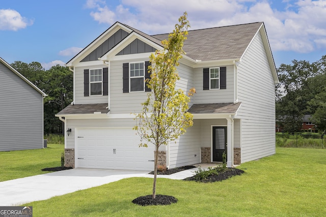 craftsman-style home with driveway, a front lawn, board and batten siding, and brick siding