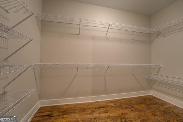 spacious closet with wood finished floors