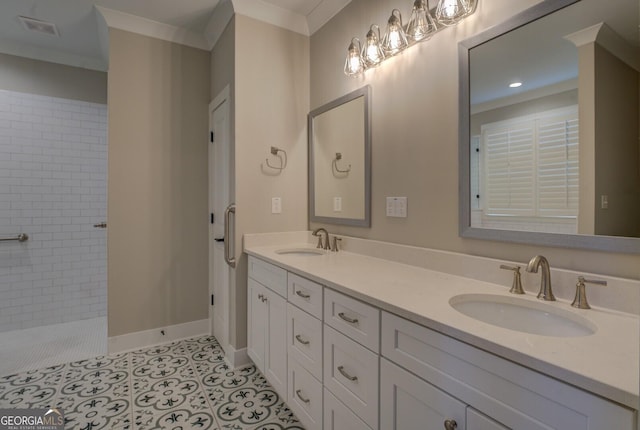 full bathroom featuring ornamental molding, tile patterned flooring, a sink, and visible vents