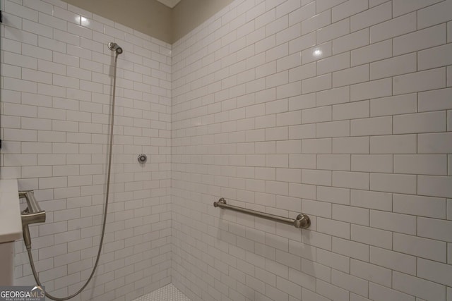 full bathroom with tiled shower