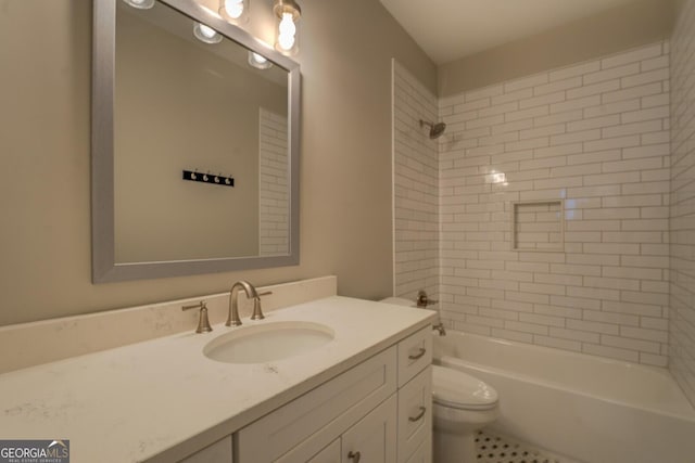 bathroom with vanity, bathtub / shower combination, and toilet